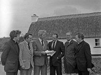 Meeting at Louisburgh Holiday Homes, September 1980 - Lyons0018242.jpg  Meeting at Louisburgh Holiday Homes, September 1980. . L-R : Fr Kevin Loftus, Ballycastle Enterprises; Joe O' Toole, Chairman of Connemara West Ltd. Tullycross; Dan O' Neill, Ireland West, Galway; Gerry Hayes, Rent an Irish Cottage Ltd, Shannon Development; Tom Murphy, Marketing Manager Shannon Development and Fr Kieran Waldron, Secretary Louisburgh Holiday Holdings, Ltd infront of the Louisburgh Holiday cottages. : 198009 Louisburgh Holiday Cottages 2.tif, Louisburgh, Lyons collection