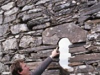 Archaeological and historical research by French students, Louisburgh, April 1987. - Lyons0018497.jpg  Archaeological & historical research by Louisburgh Students, april 1987. Justin Sammon pointing to a key stone in the church ruin. : 19870407 Archaeological & Historical Research by Louisburgh Students 4.tif, Farmers Journal, Louisburgh, Lyons collection