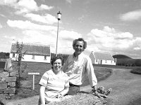 Duluth students at Louisburgh Holiday Homes, May 1987. - Lyons0018508.jpg  Two of the professors from Duluth. Duluth students at Louisburgh Holiday Homes, May 1987. : 19870501 Duluth Students at Louisburgh Holiday Homes 5.tif, 19870501 Duluth Students at Louisburgh Holiday Homes 6.tif, Farmers Journal, Louisburgh, Lyons collection