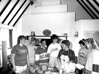 Duluth students at Louisburgh Holiday Homes, May 1987. - Lyons0018509.jpg  Baking demonstration. Third from the right is Bernadette Burke giving a baking class to the  Duluth students at Louisburgh Holiday Homes, May 1987. : 19870501 Duluth Students at Louisburgh Holiday Homes 6.tif, 19870501 Duluth Students at Louisburgh Holiday Homes 7.tif, Farmers Journal, Louisburgh, Lyons collection