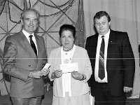 Grainne Uaile Centre, Louisburgh, July 1987 - Lyons0018518.jpg  Dermot Blythe Manager of the AIB in Westport sponsor of a competition in the new Granuaile Centre presenting a cheque to the winner. At right John Joe Kilcoyne Louisburgh Development. July 1987. : 19870724 Grainne Uaile Centre 3.tif, Louisburgh, Lyons collection