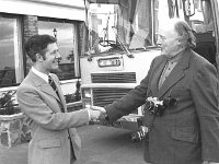 Terry O' Sullivan in Mulranny, May 1975.. - Lyons0018639.jpg  The Manager of the Great Southren Hotel Mulranny greeting a tourist on the CIE tour bus, May 1975. : 19750510 Terry O' Sullivan in Mulranny 9.tif, Irish Press, Lyons collection, Mulranny