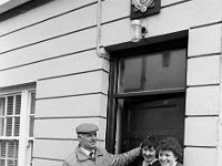 Leaving Swinford Garda station - Lyons0008746.jpg  Taking down the sign when leaving old Garda station on the main St., Swinford for the last time.