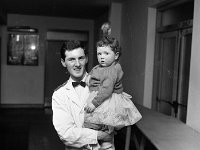 Belclare House, 1965 - Lyons00-21316.jpg  Michael Cadden who worked in Belclare House with one of the children at the Christmas party. : 19651220 Childrens' Christmas Party in Belclare House 11.tif, Belclare House, Lyons collection
