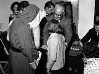 Belclare House, 1965 - Lyons00-21319.jpg  Childrens' Christmas Party in Belclare House. John Healy proprietor of Belclare house helping Santa to distribute the gifts. : 19651220 Childrens' Christmas Party in Belclare House 14.tif, Belclare House, Lyons collection