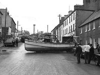 Belclare House, 1971. - Lyons00-21399.jpg  John Healy's boat which came off its trailor on James Street. The boat had gone on fire in Westport harbour and was called after his son. : 19710624 John Healy's boat 2.tif, Belclare House, Lyons collection, Westport