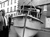 Belclare House, 1971. - Lyons00-21401.jpg  John Healy's boat which came off its trailor on James Street. The boat had gone on fire in Westport harbour and was called after his son. : 19710624 John Healy's boat 5.tif, Belclare House, Lyons collection, Westport
