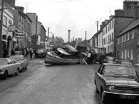 Belclare House, 1971. - Lyons00-21402.jpg  John Healy's boat which came off its trailor on James Street. The boat had gone on fire in Westport harbour and was called after his son. : 19710624 John Healy's boat 6.tif, Belclare House, Lyons collection, Westport