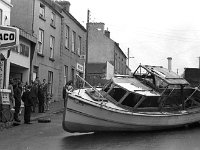 Belclare House, 1971. - Lyons00-21403.jpg  John Healy's boat which came off its trailor on James Street. The boat had gone on fire in Westport harbour and was called after his son. : 19710624 John Healy's boat 7.tif, Belclare House, Lyons collection, Westport
