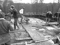 Construction of Hotel Westport, February 1970. - Lyons0019737.jpg  Hotel Westport under construction, February 1970. Compacting poker being used in the wet cement to get rid of the air bubbles. : 19700205 Hotel Westport under construction 2.tif, Lyons collection, Westport Developing