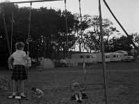 Children on the swings in the Westport House Caravan Park, June 1969.. - Lyons0018886.jpg  Children on the swings in the Westport House Caravan Park, June 1969. : 196906 Children on the swings in the Westport House Caravan Park 2.tif, Lyons collection, Westport House