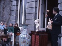 Lord Altamont showing a collection of newly acquired antiques to his family, Westport house, March 1971.. - Lyons0019214.jpg  Lord Altamont showing a collection of newly acquired antiques to his family, Westport house, March 1971. : 1970 Lord Altamont and his family.tif, Lyons collection, Westport House