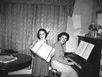 Faces and Places in Westport, 1950s. - Lyons0013542.jpg  Faces and Places in Westport, 1950s. Mother and daughter having a musical session. : 1950's Faces and Places in Westport 2.tif, 1950s Misc, Lyons collection, Westport