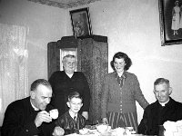 Photographed after the station mass in Mulchrone's Moyhastin. - Lyons0013553.jpg  Photographed after the station mass in Mulchrone's Moyhastin. Seated at left Fr Tom Cummins ADM, Westport; Perry Reilly, mass server and Fr Tom Lynch CC Westport. Standing Mrs Mulchrone senior and Mrs Mulchrone junior. : 1950's Faces and Places in Westport 13.tif, 1950s Misc, Lyons collection, Westport