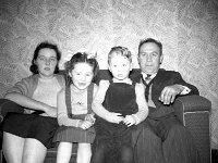 Westport blacksmith Harry Hughes with his wife, daughter Nuala and son Junior. - Lyons0013556.jpg  Faces and Places in Westport, 1950s.  Westport blacksmith Harry Hughes with his wife, daughter Nuala and son Junior. : 1950's Faces and Places in Westport 16.tif, 1950s Misc, Lyons collection, Westport