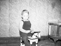Junior Hughes, son of blacksmith Harry Hughes.. - Lyons0013564.jpg  Faces and Places in Westport, 1950s. A young boy with a toy horse. Junior Hughes, son of blacksmith Harry Hughes. : 1950's Faces and Places in Westport 24.tif, 1950s Misc, Lyons collection, Westport