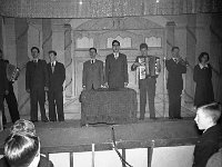 Local talent on stage in the Pavillion Ballroom, Westport. - Lyons0013568.jpg  Faces and Places in Westport, 1950s. Local talent on stage in the Pavillion Ballroom. L-R: Compere Frank Flanagan; accordian player ?; Fonsie Canning; Mickie Hastings; Kevin Regan; Dave Walsh; Alex Dempsy accordian; Larry Hingerton trumpet and lady singer ?. : 1950's Faces and Places in Westport 29.tif, 1950s Misc, Lyons collection, Westport