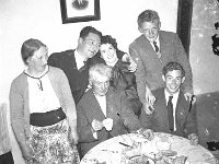 Bea Mc ging in the Derrig household., Westport. - Lyons0013569.jpg  Faces and Places in Westport, 1950s. A country house party for a return visit from the US by a Moyhastin born Westport native. Bea Mc ging in the Derrig household. Included are Mr and Mrs Derrig senior, Sam Derrig with his arm around Bea. Tony Derrig seated and a neighbour. : 1950's Faces and Places in Westport 30.tif, 1950s Misc, Lyons collection, Westport