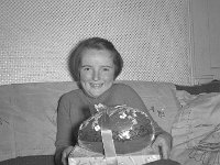 Margaret Ryder with her large Easter egg, Westport, 1955.. - Lyons0013624.jpg  Margaret Ryder with her large Easter egg, Westport, 1955.
