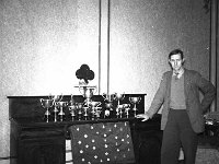 Mickie Palmer, Westport 1956. - Lyons0013682.jpg  Mickie Palmer National Champion Cyclist, 1956. Mickie in his home Brabazon House Westport photographed with his many trophies & medals. : 1956 Mickie Palmer National Champion Cyclist.tif, 1956 Misc, Lyons collection, Westport