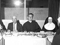 Ordination reception for Fr Mc Nally, Peter St. Westport, 1958. - Lyons0013753.jpg  Ordination reception for Fr Mc Nally, Peter St. Westport. Fr Mc Nally with his family at the reception, 1958. : 1958 Fr Mc Nally's Ordination 1.tif, Lyons collection, Westport