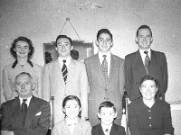 The McKenna family, Bridge St.Westport, 1958.. - Lyons0013760.jpg  The McKenna family, Bridge St.Westport, 1958.  Back row : ( left to right standing ) Maureen, Frank, Atty, Sean. Sitting Mr John McKenna, daughter Kathleen, son Joseph and John's wife Kathleen photographed in their home over the Barber Shop in Bridge St. Westport. : 1958 Mc Kenna family.tif, Lyons collection, Westport