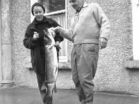 Visitors to the Railway Hotel Westport, 1964. - Lyons0013842.jpg  Visitors to the Railway Hotel Westport with a speciment salmon they caught while on fishing holiday, 1964. : 1964 Fishing Holiday.tif, Lyons collection, Westport