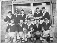 Westport rugby team in 1951. - Lyons0013947.jpg  Photo copied by Liam for Brian O'Dowd (Westport Rugby committee). Westport rugby team in 1951.   Included in the back row are Clem Collins; Tony O'Grady; Pearse Gill; David McKeon and Charlie Garavan.  Front row : Stephen and Liam Walsh; Paddy Hoban and Noel Gill. : 196607 Photo copied for Brian O'Dowd.tif, Lyons collection, Westport