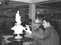 The Westport Octagon Restoration Reception in Hotel Westport, July 1989. - Lyons0014263.jpg  The Westport Octagon Restoration Reception in Hotel Westport, July 1989.  Sculptor Ken Thompson discussing the scale model with stained glass artist Patrick Rye. : 198907 Westport Monument Restoration 2.tif, Lyons collection, Westport