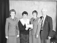 Fashion show in Colettes Boutique, Westport, April 1991. - Lyons0014279.jpg  Fashion show in Colettes Boutique, Westport, April 1991.  Second from the left Peggy McDonnell Manager of the boutique presenting a cheque to Celine O'Grady, Murrisk on behalf of Westport Order of Malta. At left Order of Malta Cadet Ryder and at right Colm Feeney proprietor of Collette Boutique. : 199104 Presentation Cheque to Knights of Malta.tif, Lyons collection, Westport