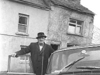 Mayo Co. Cllr Tommt Giblin1968. - Lyons0014532.jpg  Mayo Co. Cllr Tommt Giblin outside his house on High St. Westport, April 1968. : 19680404 Tommy Giblin.tif, Lyons collection, Westport