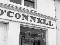 O' Connell's Electrical Shop on Bridge St. Westport, February 1971. - Lyons0014653.jpg  O' Connell's Electrical Shop on Bridge St. Westport, February 1971. Shanley Brothers' drapery shop reflected in the window. : 1971 Misc, 19710224 George O' Connell's Electrical Shop on Bridge St.tif, Lyons collection
