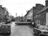 John Healy's boat which came off its trailor on James Street, June 1971. - Lyons0014672.jpg  John Healy's boat which came off its trailor on James Street, June 1971.  The boat had gone on fire in Westport harbour. : 19710624 John Healy's boat 1.tif, Lyons collection, Westport