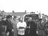 St. Patricks day parade in Westport, March 1974. - Lyons0014840.jpg  St. Patricks day parade in Westport, March 1974.   L-R : Dr Bert Farrell Medical Officer Westport Order of Malta; Dr Mc Hugh, Galway from the National Council; Cannon Eamon O' Malley ADM St. Mary's Westport; Captain William Lyons, Westport Order of Malta; Cannon Mc Ginley, Holy Trinity Church Westport and Liutnant Peadar Flanagan Westport Order of Malta : 19740317 St Patricks Day Parade 3.tif, Lyons collection, Westport