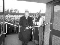 Opening of the Mc Bride Home in St Mary's Crescent Westport, December 1974 - Lyons0014893.jpg  Opening of the Mc Bride Home in St Mary's Crescent Westport, December 1974 and mass afterwards in St Mary's Church. Sean Mc Bride cutting the tape at the Mc Bride Home. : 19741230 Opening of the Mc Bride Home 2.tif, Lyons collection, Westport