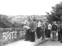 Graffitti in Westport, July 1978.. - Lyons0015038.jpg  Michael Cavanagh Chairman of Westport UDC with fellow councillors, local business people and friends painting out the " Brits Out " graffitti which was painted around the town by local IRA. July 1978.  Michael Cavanagh Chairman of Westport UDC with fellow councillors, local business people and friends painting out the " Brits Out " graffitti which was painted around the town by local IRA. Graffitti in Westport. : 1978 Misc, 19780727 Graffitti in Westport 4.tif, Lyons collection, Westport