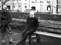 Broddie Gibbons relaxing on a seat on the Mall Westport, February 1984.. - Lyons0015202.jpg  Retired Westport town council plumber Broddie Gibbons and also an avid fisherman on lakes and rivers relaxing on the Mall and having a word with his neighbour John Mulhern. February 1984. : 19840203 The Mall Westport.tif, Lyons collection, Westport