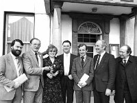 Railway Hote  Westport, March 1984... - Lyons0015222.jpg  Mickey Cavanagh second from the left former owner of the Railway Hotel, Westport, handing over the keys to the new owners Vera and Edward Rosenkratz. At left solicitor John Morahan, James St; fifth from the left Patrick Durcan, James St Westport; Dermot Blythe and Oliver P Morahan solicitor. March 1984. : 19840330 Railway Hotel.tif, Lyons collection, Westport