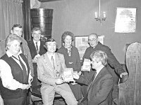 At the launching in the Helm of the Westport Historical Journal, December 1986. - Lyons0015380.jpg  Launching the Westport Historical journal in the Helm.  Front row : Cllr Margaret Adams UDC; John Joe O' Malley Chairman Westport UDC; Jarlath Duffy Chairman Westport Historical Society.  December 1986.  Back row L-R : Cllr Cormac Hughes Westport UDC; Cllr Sean Staunton Westport UDC; Sheilia Molloy Westport Historical Society and Cannon Eamon O' Malley ADM St Mary's Westport. (Neg 16) : 19861205 Westport Historical Society 2.tif, Historical, Lyons collection