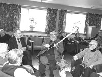 Martin Keane andMichael O' Malley entertaining his  fellow residents in the McBride Home Westport, April 1987. - Lyons0015408.jpg  Michael O' Malley entertaining his  fellow residents in the McBride Home Westport, April 1987. : 19870402 The Mc Bride Home Westport .tif, 19870402 The Mc Bride Home Westport 1.tif, Farmers Journal, Lyons collection