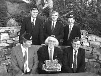 Westport Tourism Committee 1989... - Lyons0015552.jpg  Westport Tourism Committee commemorating Louis Haeglie's 60th visit to Westport. At left beside Louis is Tony O' Keefe Chairman of Westport Tourism. At right Tony Dawson Ireland West. Back row at left Seamus Hughes, Westport UDC; Sean Staunton PRO Westport Tourism; Michael O' Donnell Chairman Marketing Committee wearing traditional Swiss caps presented by Louis. May 1989. : 19890519 Westport Tourism Presentation.tif, Lyons collection, Westport