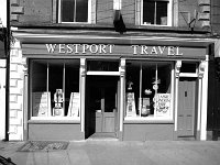Westport Travel, July 1989. - Lyons0015565.jpg  Westport Travel (proprietor Jerome Kiely) which has replaced John Gibbon's family grocer, July 1989. : 19890708 Westport Travel.tif, Lyons collection, Westport