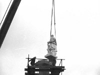 Placing the statue of St. Patrick on top of the pedestal on the Octagon, March 1990 - Lyons0015629.jpg  Placing the statue of St. Patrick on top of the pedestal on the Octagon, March 1990. : 19900307 Placing of the Statue of St Patrick 12.tif, Lyons collection, Westport