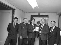 Lions Club Seiko clock competition 1993. - Lyons0015805.jpg  Lions Club Seiko clock competition; the clock was placed in the Bank of Ireland safe for 30 days and people had to guess the time the clock stopped. Centre James Murtagh, Westport jeweler with Bank of Ireland staff and the Garda superintendent. March 1993. : 19930305 Lions Seiko Watch Competition.tif, Lyons collection, Westport