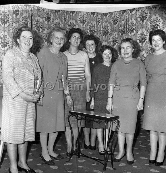 Mrs Whelan (second from the right) receiving a gift of a table from the executive of the ICA, 1965