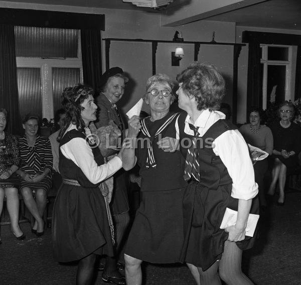 ICA putting on party peice at farwell party for Mrs Whelan, 1965