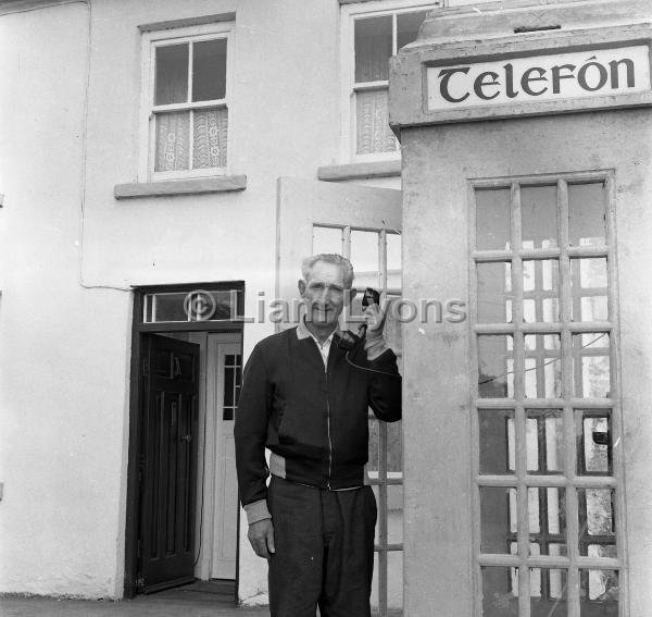 Dan O' Brien & the first phone kiosk at Westport Quay, August 1966