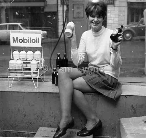 Ann O' Grady working in Burke's Garage