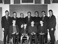 Westport Credit Union Essay Competition, December 1965. - Lyons0000429.jpg  Westport Credit Union Essay Competition, December 1965. Front row:  Winners with their trophies.  Back row: Jim Lyons, Shop St & VEC; Basil Morahan CBS; Michael Browne Solicitor; Brother Manning; Martin Mc Guire CBS & Sean Staunton, Journalist. : collection, Credit, Essay, Union, Westport