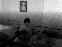 Housed travellers - Lyons0001068.jpg  Housed traveller putting her children to bed in her new home. Original folder, 1968 Misc : Travellers